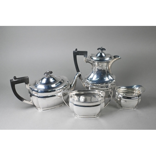 40 - A heavy quality silver four-piece tea service including hot water jug, with ebonised finials and com... 