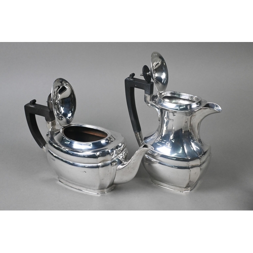 40 - A heavy quality silver four-piece tea service including hot water jug, with ebonised finials and com... 