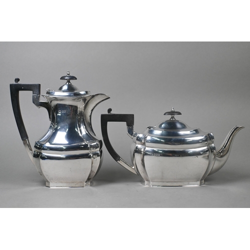 40 - A heavy quality silver four-piece tea service including hot water jug, with ebonised finials and com... 