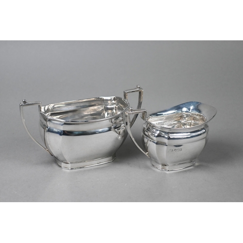 40 - A heavy quality silver four-piece tea service including hot water jug, with ebonised finials and com... 