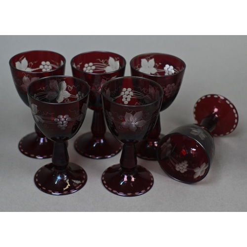 421 - A pair of 19th century continental ruby flash decanters with vine-etched decoration, 19.5 cm, to/w a... 