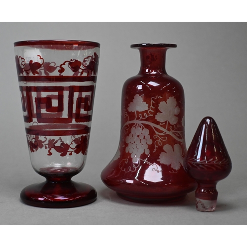 421 - A pair of 19th century continental ruby flash decanters with vine-etched decoration, 19.5 cm, to/w a... 