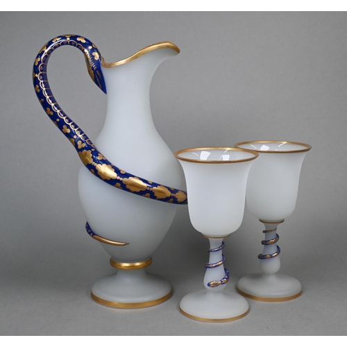 422 - A 19th century Venetian frosted glass jug of baluster form with blue and gilt winding 'snake' handle... 