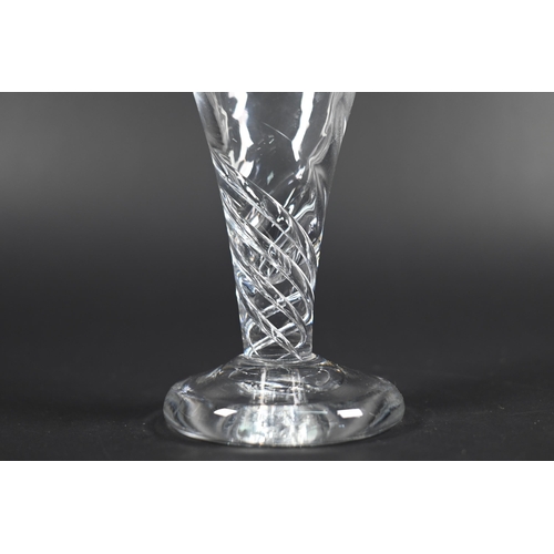 427 - A Georgian toastmaster's glass with octagonal cut tapering bowl on heavy blade knop stem, flared foo... 