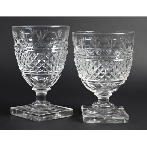 428 - A set of four Regency cut glass small rummers on stemmed and star-cut square bases, 8.5 cm (4)