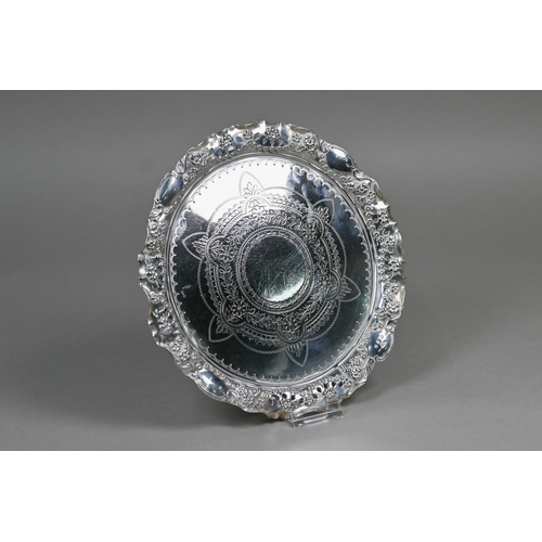 43 - A Victorian silver letter salver with engraved decoration and embossed and pierced rim, William Deve... 