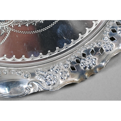 43 - A Victorian silver letter salver with engraved decoration and embossed and pierced rim, William Deve... 