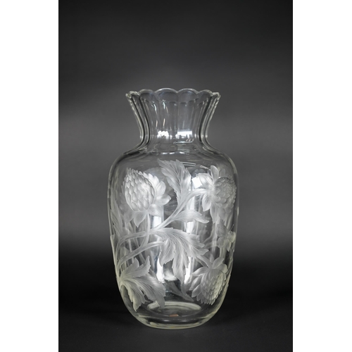 432 - A vintage glass vase, deep-cut with chrysanthemums and butterflies, 27 cm high