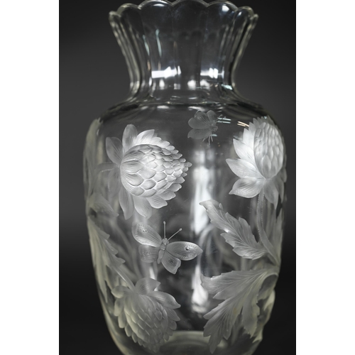 432 - A vintage glass vase, deep-cut with chrysanthemums and butterflies, 27 cm high