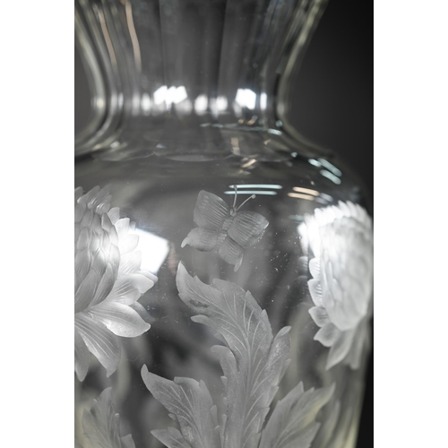 432 - A vintage glass vase, deep-cut with chrysanthemums and butterflies, 27 cm high