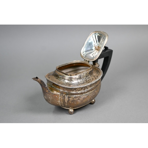 44 - A silver three-piece bachelor tea service with gadrooned rims, composite handle and finial, on ball ... 