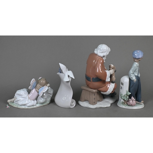 445 - A boxed Lladro 'Santa's Magical Workshop' figure 6390, to/w four other figures 'Princess of the Fair... 