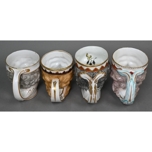 457 - A collection of six Georgian Derby 'Neptune' mask mugs, to/w two Bacchanalian examples (8)