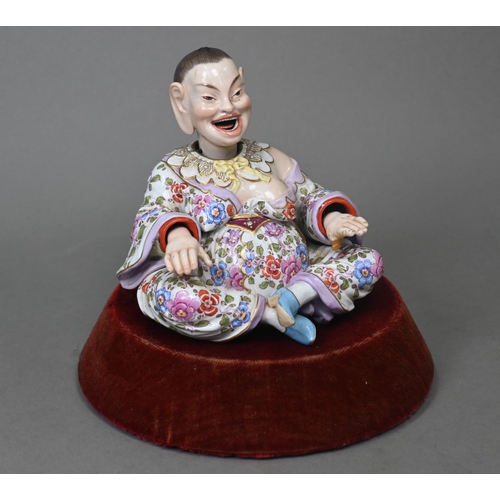 465 - A 19th century Meissen female nodding 'Pagoda' figure, seated cross-legged, with moving tongs and ha... 