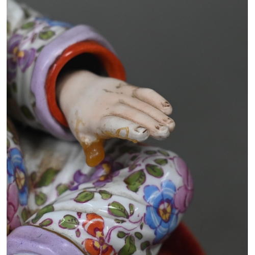 465 - A 19th century Meissen female nodding 'Pagoda' figure, seated cross-legged, with moving tongs and ha... 