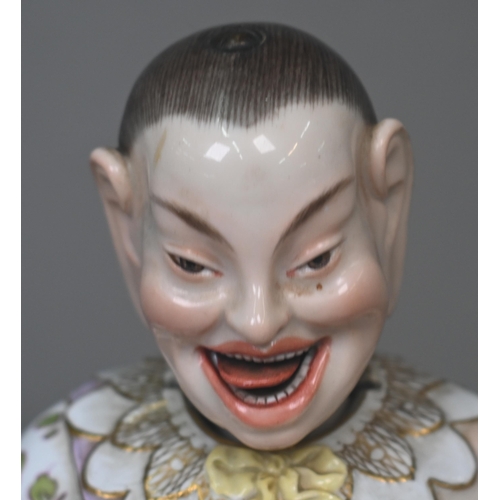 465 - A 19th century Meissen female nodding 'Pagoda' figure, seated cross-legged, with moving tongs and ha... 