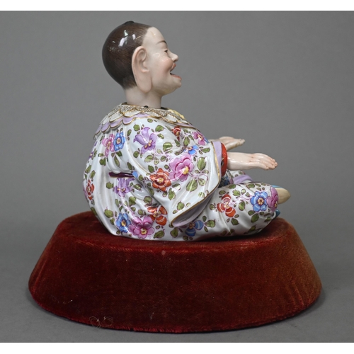 465 - A 19th century Meissen female nodding 'Pagoda' figure, seated cross-legged, with moving tongs and ha... 