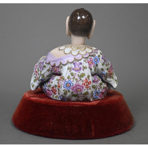 465 - A 19th century Meissen female nodding 'Pagoda' figure, seated cross-legged, with moving tongs and ha... 