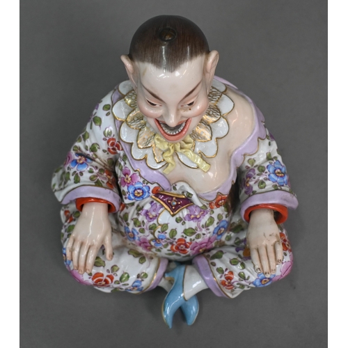 465 - A 19th century Meissen female nodding 'Pagoda' figure, seated cross-legged, with moving tongs and ha... 