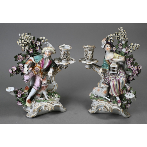 467 - A pair of Georgian Derby porcelain bocage groups/candelabra, modelled with a man with dog and bird, ... 