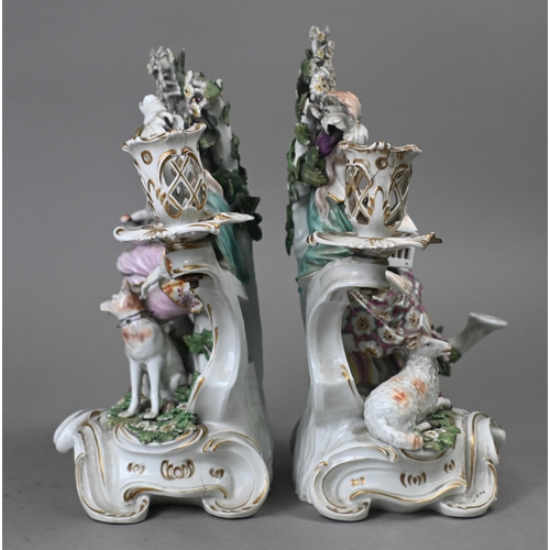 467 - A pair of Georgian Derby porcelain bocage groups/candelabra, modelled with a man with dog and bird, ... 