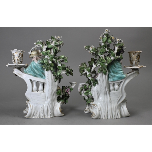 467 - A pair of Georgian Derby porcelain bocage groups/candelabra, modelled with a man with dog and bird, ... 