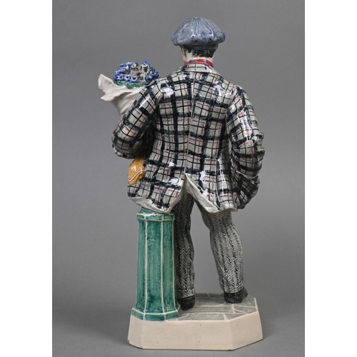 469 - A Charles Vyse Chelsea pottery figure, 'The Cinneraria Boy', blue painted 'CV (monogram) Chelsea 192... 