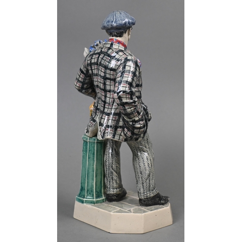 469 - A Charles Vyse Chelsea pottery figure, 'The Cinneraria Boy', blue painted 'CV (monogram) Chelsea 192... 