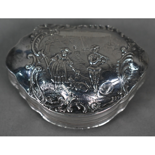 47 - A 19th Century Continental silver snuff box, embossed with rustic couples, London import 1899, to/w ... 