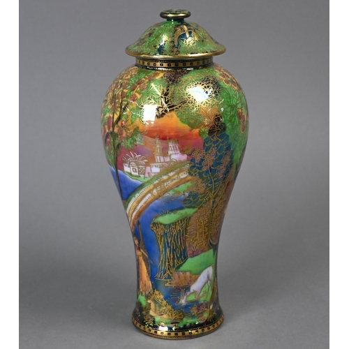 477 - A Daisy Makeig-Jones for Wedgwood Fairyland lustre vase and cover with painted and gilded fairies in... 