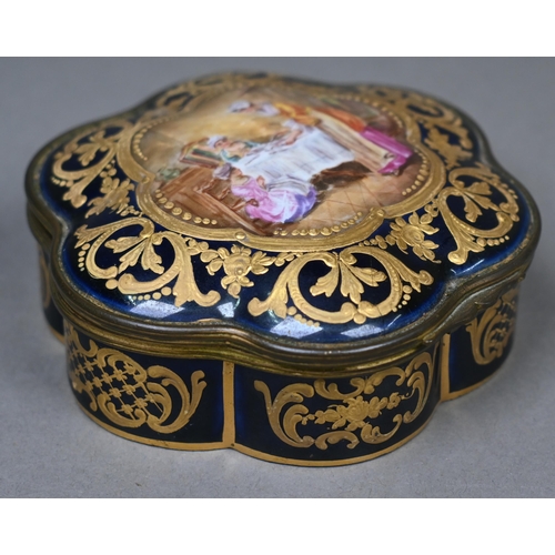 486 - A 19th century French porcelain box of lobed form with gilt brass hinges, the cover painted with int... 