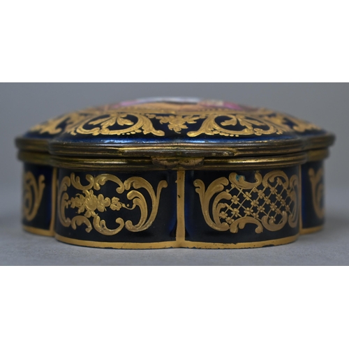 486 - A 19th century French porcelain box of lobed form with gilt brass hinges, the cover painted with int... 