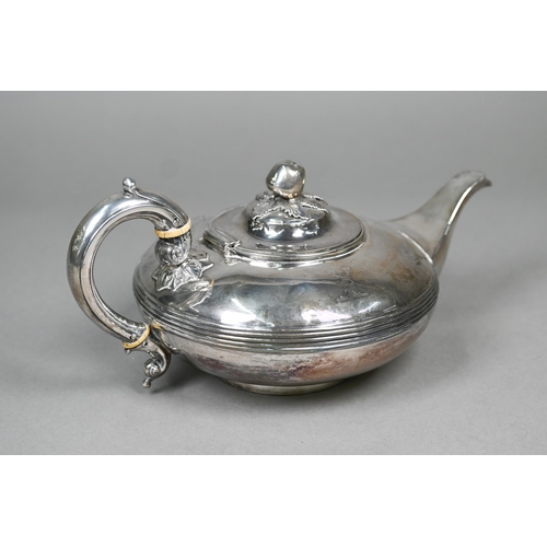 50 - A Victorian silver teapot of compressed form with apple finial, reeded waist and scroll handle with ... 