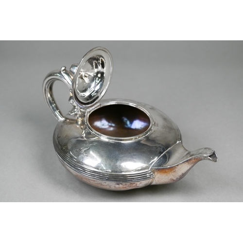 50 - A Victorian silver teapot of compressed form with apple finial, reeded waist and scroll handle with ... 