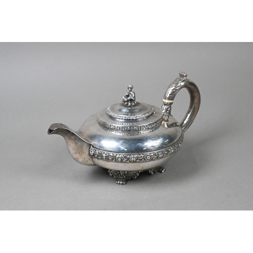 55 - A George IV silver teapot in the Regency taste, the finial cast as a seated Eastern figure, above ch... 