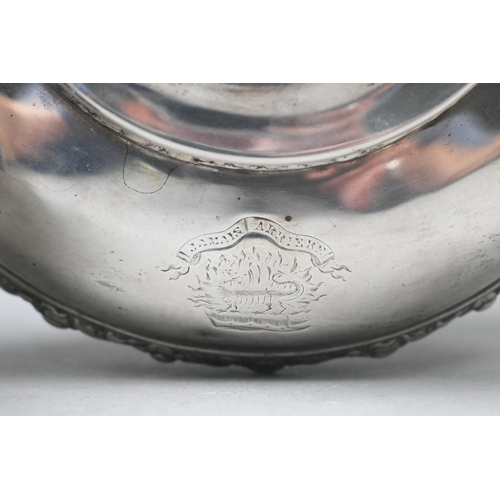 55 - A George IV silver teapot in the Regency taste, the finial cast as a seated Eastern figure, above ch... 