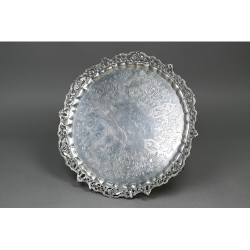 56 - A heavy quality Victorian silver salver tray with chased and pierced scrolling rim and engraved stra... 