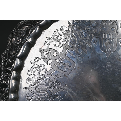 56 - A heavy quality Victorian silver salver tray with chased and pierced scrolling rim and engraved stra... 