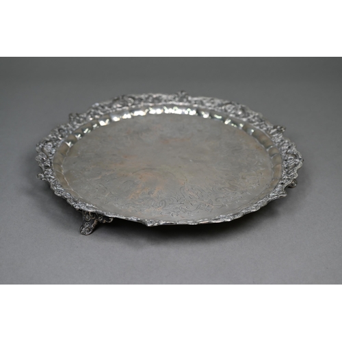 56 - A heavy quality Victorian silver salver tray with chased and pierced scrolling rim and engraved stra... 