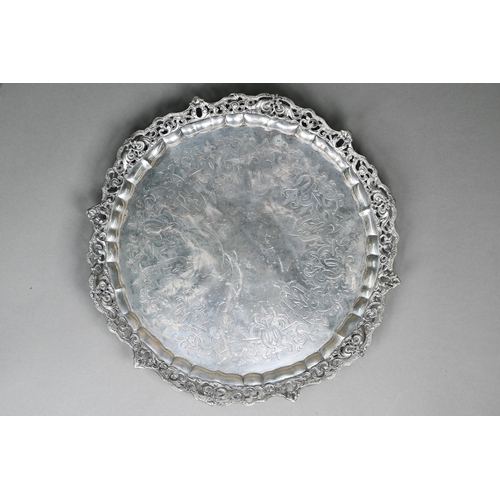 56 - A heavy quality Victorian silver salver tray with chased and pierced scrolling rim and engraved stra... 