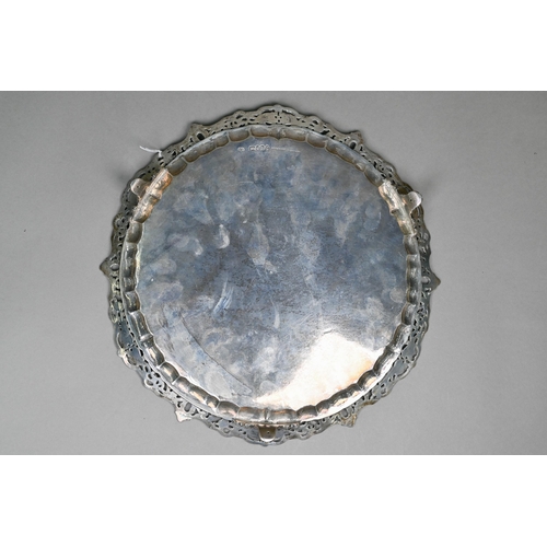 56 - A heavy quality Victorian silver salver tray with chased and pierced scrolling rim and engraved stra... 