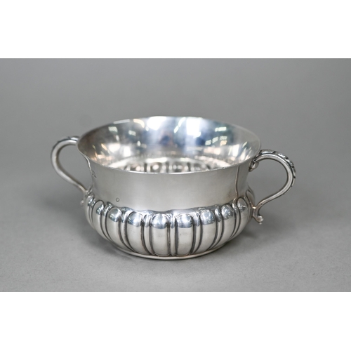 58 - A heavy quality silver porringer with half-reeded body and twin scroll handles, Edward Barnard &... 