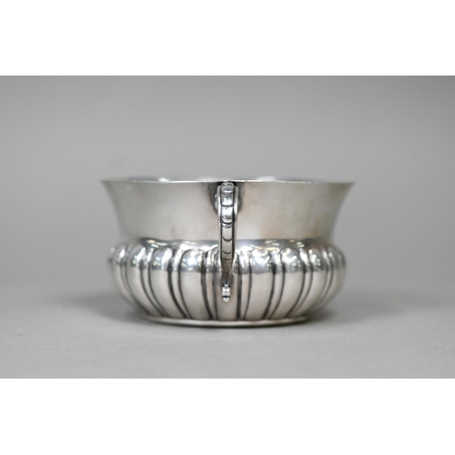 58 - A heavy quality silver porringer with half-reeded body and twin scroll handles, Edward Barnard &... 