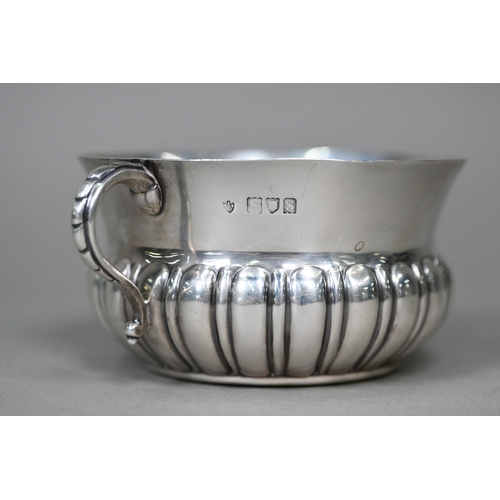 58 - A heavy quality silver porringer with half-reeded body and twin scroll handles, Edward Barnard &... 