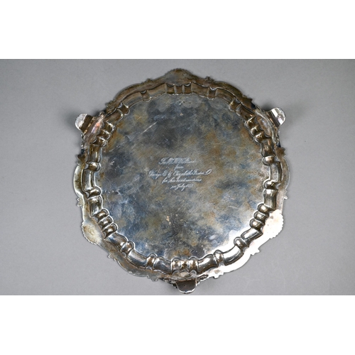 59 - An early Victorian silver salver with engraved decoration and moulded, shell and scroll rim, on scro... 