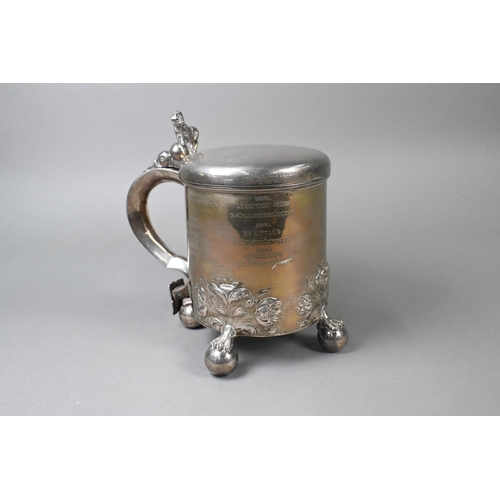 60 - Military interest: a heavy quality Victorian silver peg tankard, the hinged cover with lion and glob... 