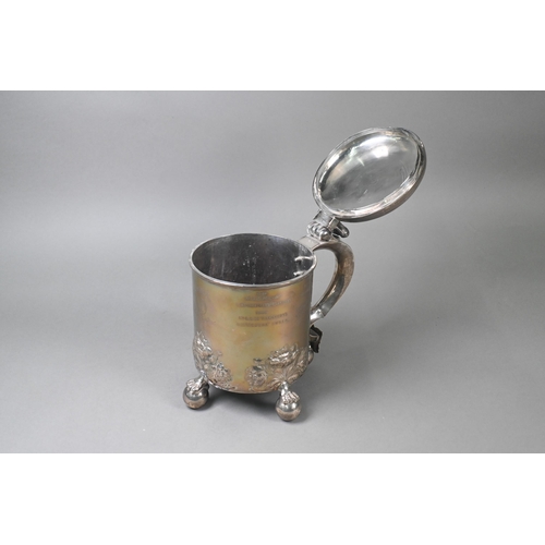 60 - Military interest: a heavy quality Victorian silver peg tankard, the hinged cover with lion and glob... 