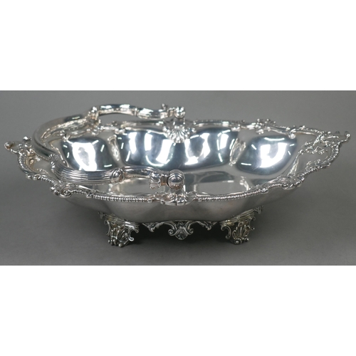 65 - Garrards: a very heavy quality George IV silver fruit basket with scrolling swing handle and lobed b... 