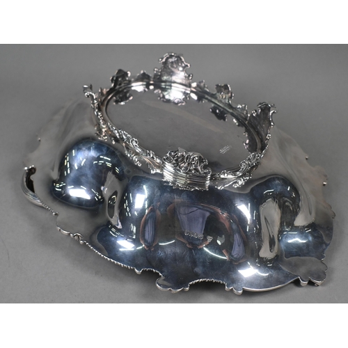 65 - Garrards: a very heavy quality George IV silver fruit basket with scrolling swing handle and lobed b... 