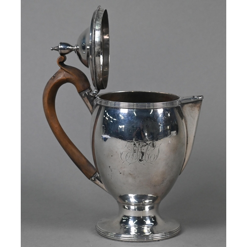 67 - A George III silver chocolate pot of ovoid form, the domed lid with urn finial, carved wood handle, ... 